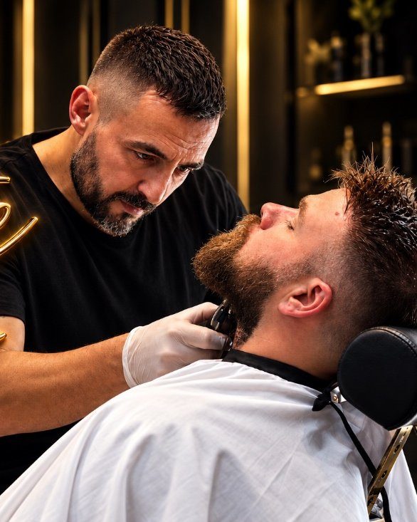 Hak trimming a client’s beard at The Private Chair