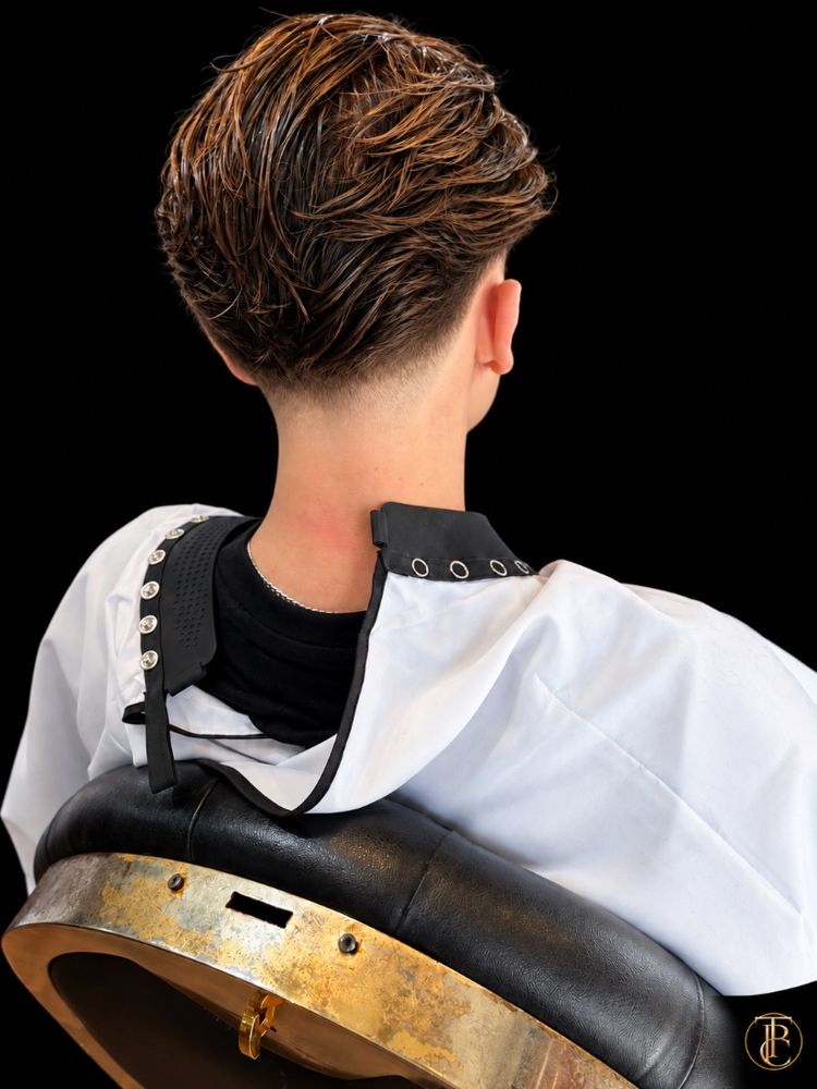 Copper highlights through a textured cut with a low taper, at The Private Chair